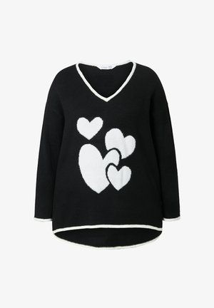 Zwarte trui met een V-hals, voorzien van witte hartpatronen. Zachte textuur, lange mouwen en contrasterende witte bies langs de randen.