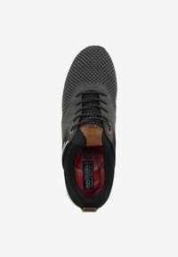 Black and gray sneaker with woven texture, round toe, and lace-up design. Features brown leather accent on heel and red interior lining.