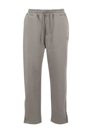 Sive hlače iz mehkega materiala, z elastičnim pasom in vrvicami, stranskimi žepi in zoženimi odprtinami za noge.