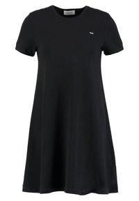 Černé bavlněné šaty v T-shirt stylu s kulatým výstřihem, krátkými rukávy a A-liniovým siluetam. Malý bílý detail loga na hrudi.