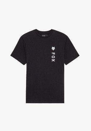 Camiseta negra de algodón con cuello redondo. Presenta un logo de zorro blanco y el texto "FOX" en alineación vertical en el lado izquierdo.