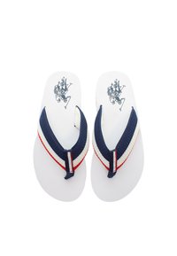 Navy ja valged plätud tekstuuriga rihmaga, punaste aktsentidega ja grafikaga tallal. Lame tald ja avatud varvaste disain.