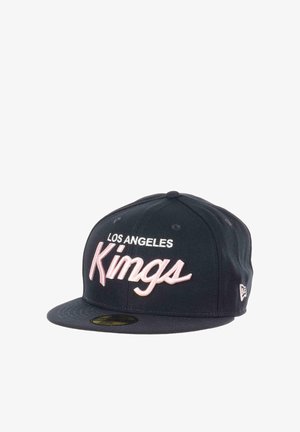Black snapback cap with embroidered text: "LOS ANGELES" in white and "Kings" in pink. Features a flat brim and structured crown.