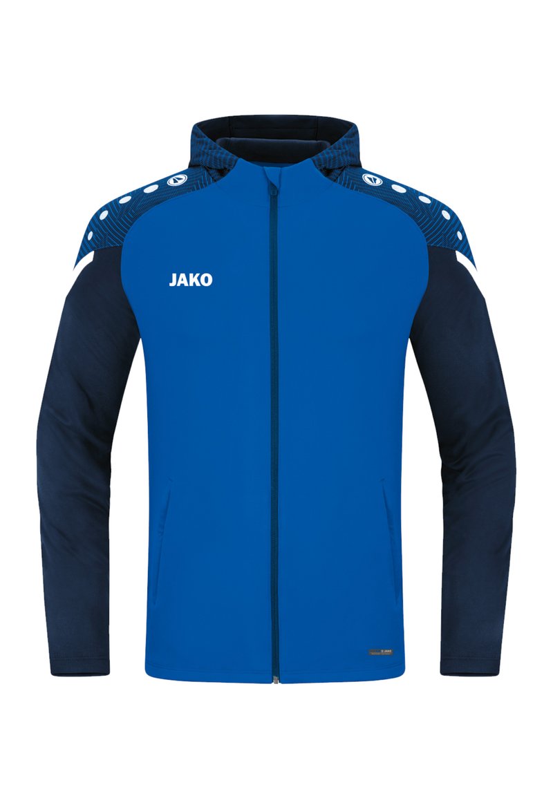 Blauwe sportjacket met een marineblauwe basis, beschikt over een ritssluiting aan de voorkant, een gestructureerde schouder en witte accenten met "JAKO" branding.
