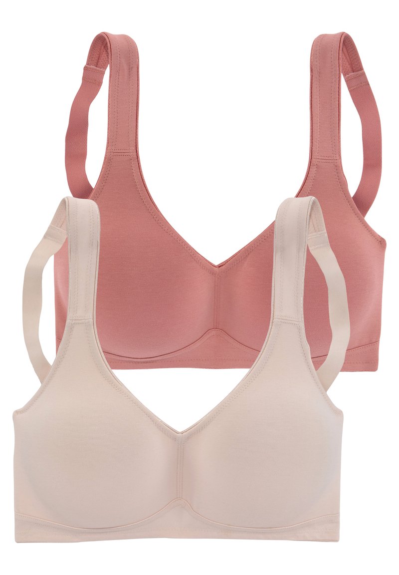 Zwei BHs in Pink und Beige, aus weichem Stoff. Sie besitzen breite Träger, ein V-Ausschnitt-Design und eine glatte, nahtlose Verarbeitung.