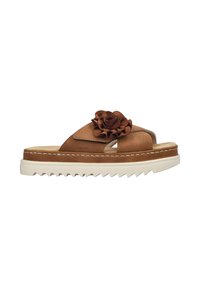 Brown leather slide sandal with a raised floral accent, cushioned footbed, and white serrated sole for traction. Stitched detailing visible.