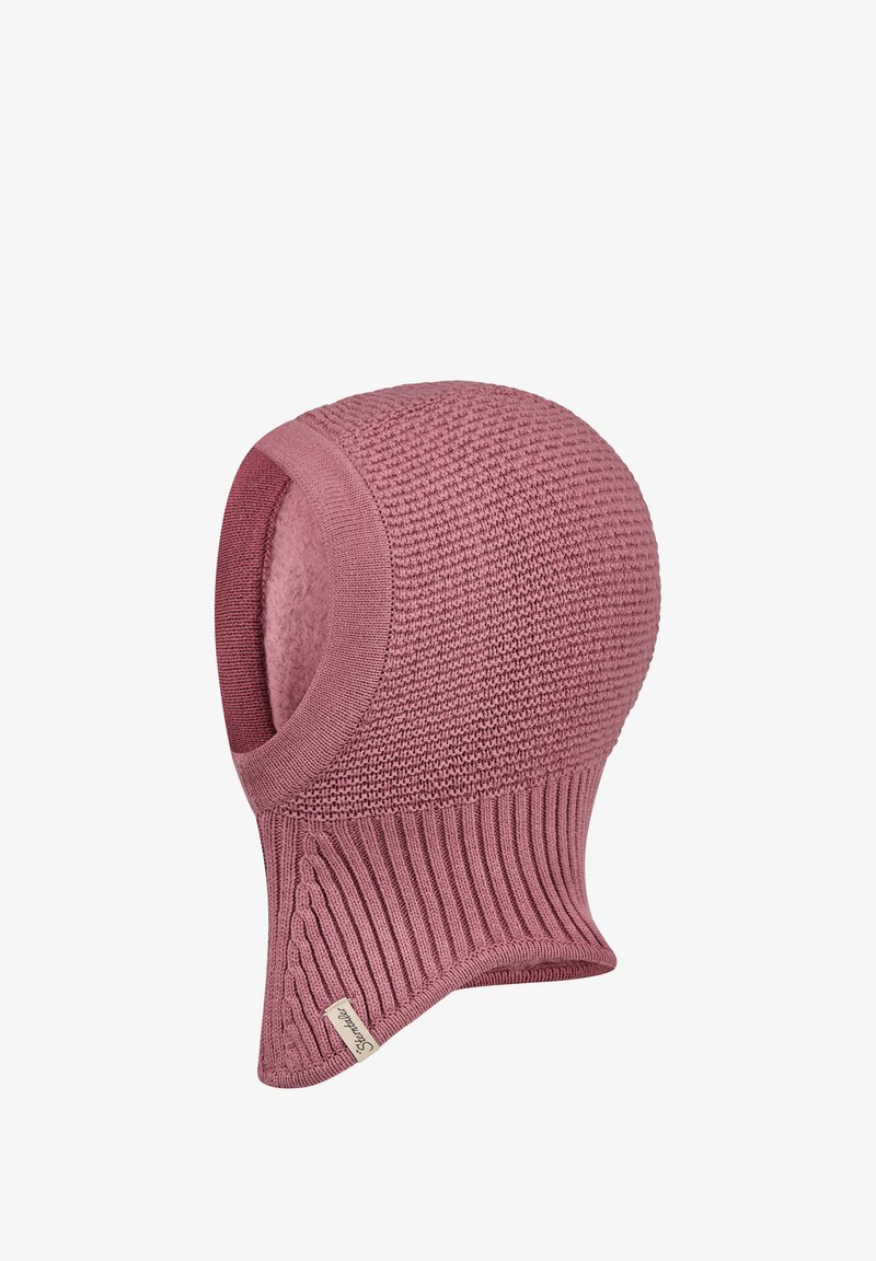 Knitted pink beanie with ribbed hem. Smooth outer texture with a patterned top, featuring a small label on the side.