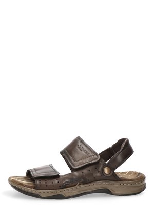 Sandalia marrón de cuero con puntera abierta, correas ajustables de velcro y suela acolchada diseñada para comodidad y uso casual.