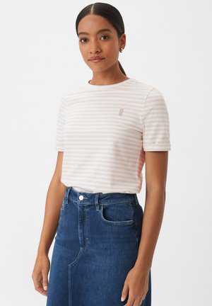 Striped shirt in soft fabric with a round neckline and short sleeves; features light pink and white stripes and subtle logo detail. Paired with a blue denim skirt.