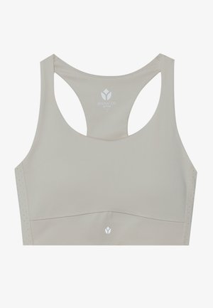 Lys beige sportsbh med en jevn tekstur, racerback-design og perforerte detaljer. Har en logo trykket på midten foran.