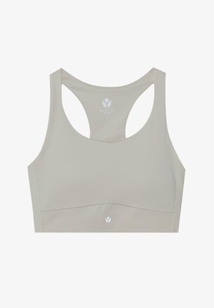 Svetlo béžový športový podprsenka s hladkou textúrou, dizajnom na chrbte a perforovanými detailmi. Obsahuje logo potlačené na prednom strede.