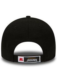 Cappello nero con visiera piatta. Presenta una fascia in tessuto sul retro, con la scritta "JACKSONVILLE JAGUARS" e un emblema rosso e bianco.