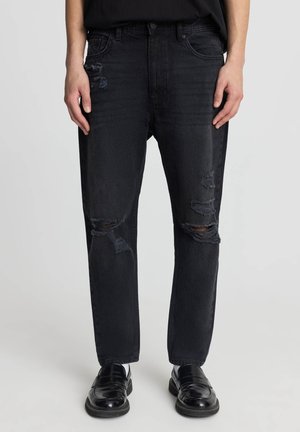 CON STRAPPI - Jeans Tapered Fit - nero denim