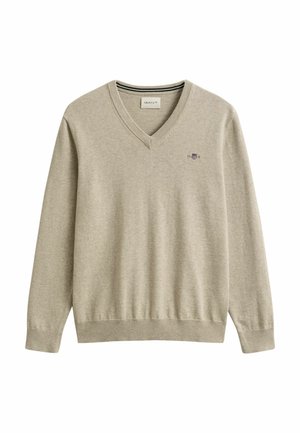 Beige V-hals trui met lange mouwen, geribbelde manchetten en zoom, voorzien van een klein geborduurd logo op de linkerborst.