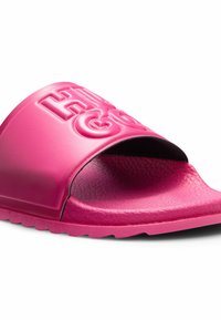 Bright pink slide sandal made of smooth rubber with raised "HI" and "GO" lettering on the band. Textured insole for grip.