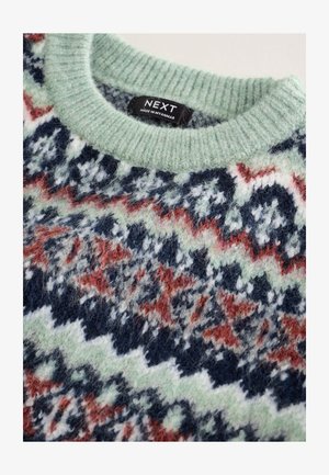 Pull en tricot avec un col côtelé vert menthe, présentant un motif en zigzag multicolore en rouge, blanc, bleu marine et nuances de vert.