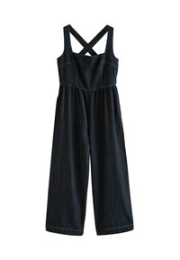 Mörk denim jumpsuit med korsade axelband, vida ben och elastisk midja. Har kontrasterande sömmar och en figurnära bodice.