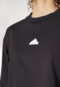 adidas Sportswear FUTURE ICONS THREE STRIPES LONG SLEEVE - Long sleeved top - black