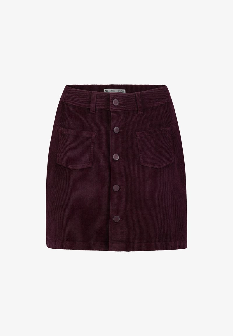 Dunkellila Cordrock mit Vorderknöpfen, Gürtelschlaufen und zwei aufgenähten Vordertaschen, präsentiert auf einem weißen Hintergrund.