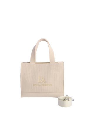 Bolso tote beige con textura acanalada, asas superiores y correa de hombro desmontable, con gran logo dorado "Don Algodon" en la parte frontal.