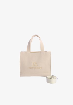 Bolso tote beige con textura acanalada, asas superiores y correa de hombro desmontable, con gran logo dorado "Don Algodon" en la parte frontal.