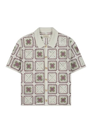 Gehaakte cardigan met korte mouwen en knopen aan de voorkant, met een rasterpatroon van paarse en groene bloemenvierkanten op een crèmekleurige achtergrond.