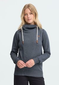 Grijze rits hoodie met een capuchonnek, verstelbare koordjes en leren accenten. Heeft een zachte textuur en nauwsluitende manchetten.