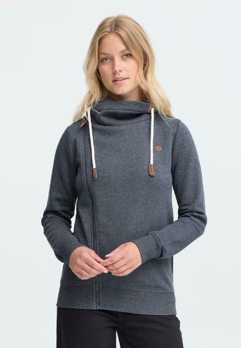 Grijze rits hoodie met een capuchonnek, verstelbare koordjes en leren accenten. Heeft een zachte textuur en nauwsluitende manchetten.
