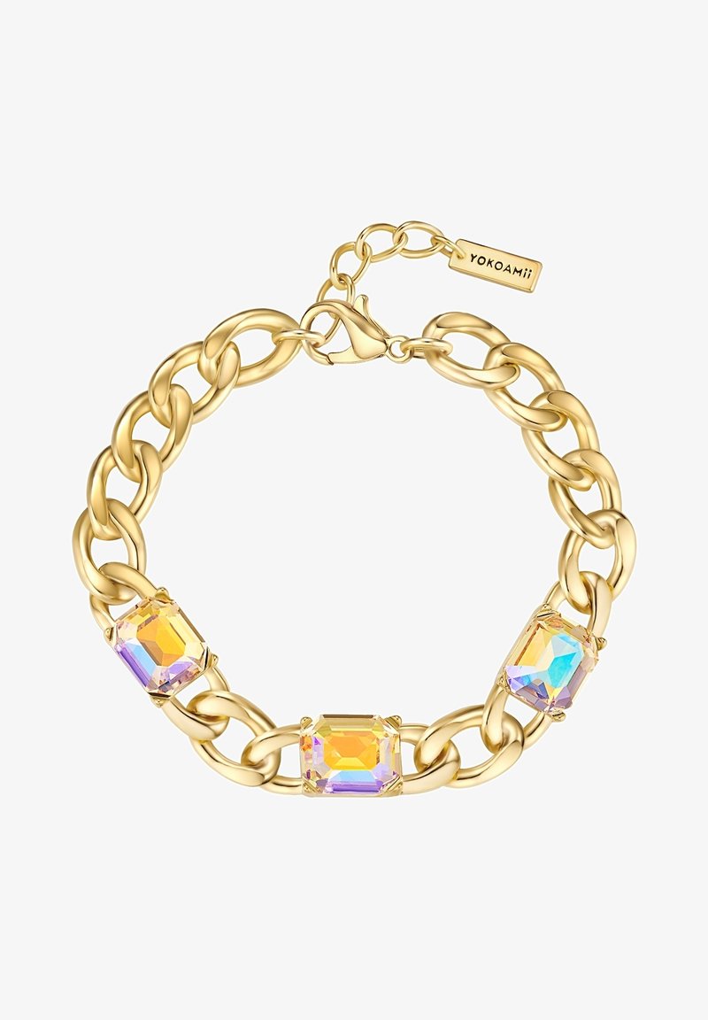 Kuldse tooniga ahelrõngas, millel on kolm ristkülikukujulist, fašeeritud kivi, mis säravad iridesseerivates värvides. Lukk on kinni klambri ja brändiehega.