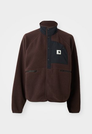 Dark brown fleece jacket with high collar, black button placket, zip pockets, and black chest patch with white logo.