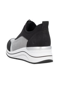Black and white athletic shoe with a textured black upper, mesh panels, and white cushioned sole with silver accents and a back pull tab.