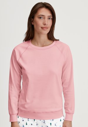 Roze sweatshirt met een ronde hals en lange raglanmouwen. Gemaakt van een gladde stof met een ribbelzoom en manchet.
