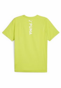 Lühikeste varukatega, erksat laime roheline spordisärk, mis on valmistatud tekstuuriga kangast. Seljal on valge "PUMA" brändingu ja logo.