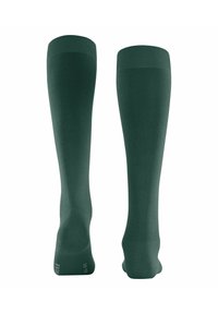 Calze al ginocchio di colore verde scuro, realizzate in materiale liscio ed elastico, con bordi rigati e suole rinforzate per garantire durata.