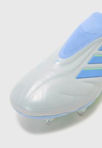 Light blue soccer cleat with a smooth, glossy surface. Features a textured sock-like collar and three accent stripes in darker blue.