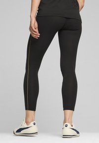 Puma MINIMAL GOLD - Leggings - black