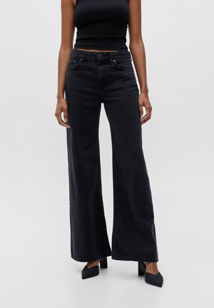 Flared jeans - mottled black