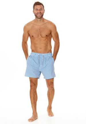 Shorts de bain bleu et blanc à rayures en tissu léger, dotés d'une taille élastique, d'un cordon de serrage et de poches latérales.
