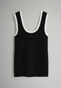 Čierne tielko bez rukávov s výstrihom dookola, s bielou lemovkou okolo okrajov na rukách a výstrihu. Mäkká pletená látka, rovný strih.