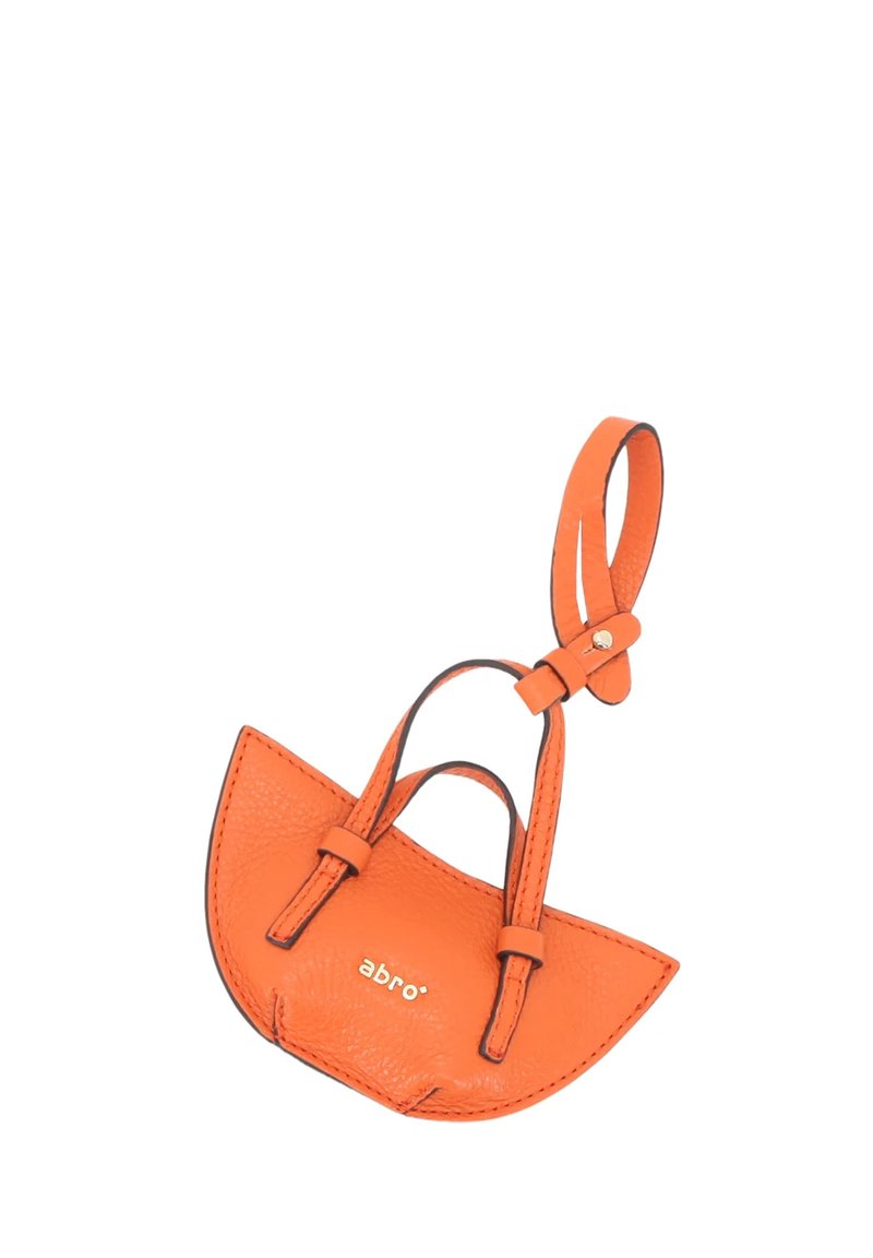 Orange leather mini handbag with a curved shape, two short straps, and a small gold logo. Textured finish and reinforced stitching details.
