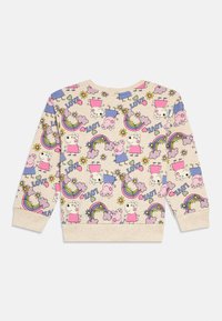 Felpa beige chiaro con personaggi dei cartoni animati colorati, fiori e arcobaleni in un motivo ripetuto. Tessuto morbido con polsini a costine.