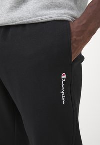 Champion ICONS HEM PANTS - Treniņtērpa apakšdaļas - black
