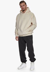 Dropsize LOOSE FIT  - Træningsbukser - black