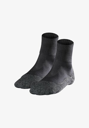Pair of black and dark gray crew socks with reinforced toes and heels, designed for comfort and durability.