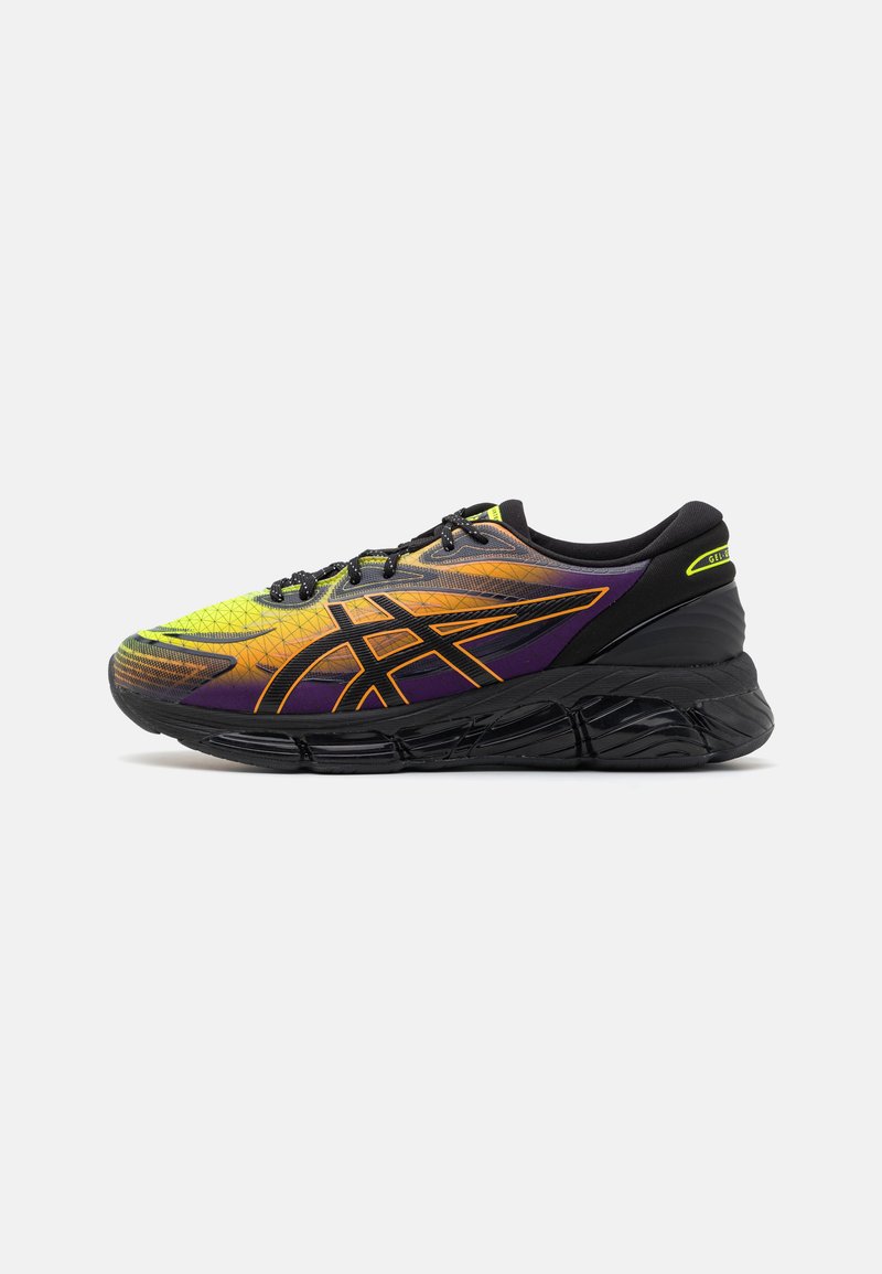 Men's running shoes with a textured yellow-green upper, purple accents, a black sole, and orange detailing on the side and back.