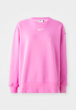 Pink Nike sweatshirt with a crew neck, long sleeves, and a white logo on the chest. Soft fabric with ribbed cuffs and hem.