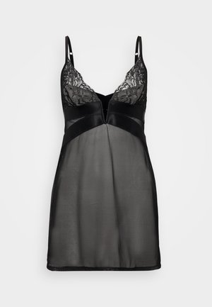 Črna neglegé obleka z čipkastim robom na bustu, prosojna telesa in satenskimi poudarki. Nastavljive naramnice in V-izrez z rahlim razširjenjem pri robu.