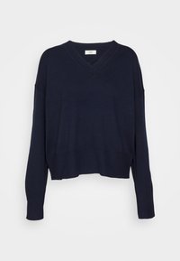 Granatowy sweter w kształcie litery V z długimi rękawami, krótkim dołem oraz ściągaczami na rękawach i w talii. Wykonany z miękkiego dzianinowego materiału.