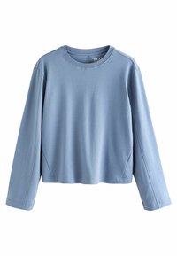 Cămașă albastru deschis cu mânecă lungă, fabricată dintr-un material moale, având un gât rotund și o croială lejeră, cu detalii coase pe mâneci.