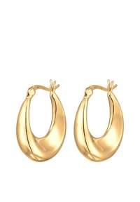 Orecchini ad anello in tono oro con una forma liscia e arrotondata e finitura lucida. Presentano un particolare dettaglio manuale nella parte superiore per la chiusura.